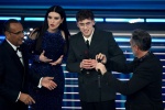 (L-R) Sanremo Festival host and artistic director Carlo Conti with Italian singer Laura Pausini and Italian singer Tredici Pietro on stage at the Ariston theatre during the 76th Sanremo Italian Song Festival, Sanremo, Italy, 24 February 2026. The Music Fe