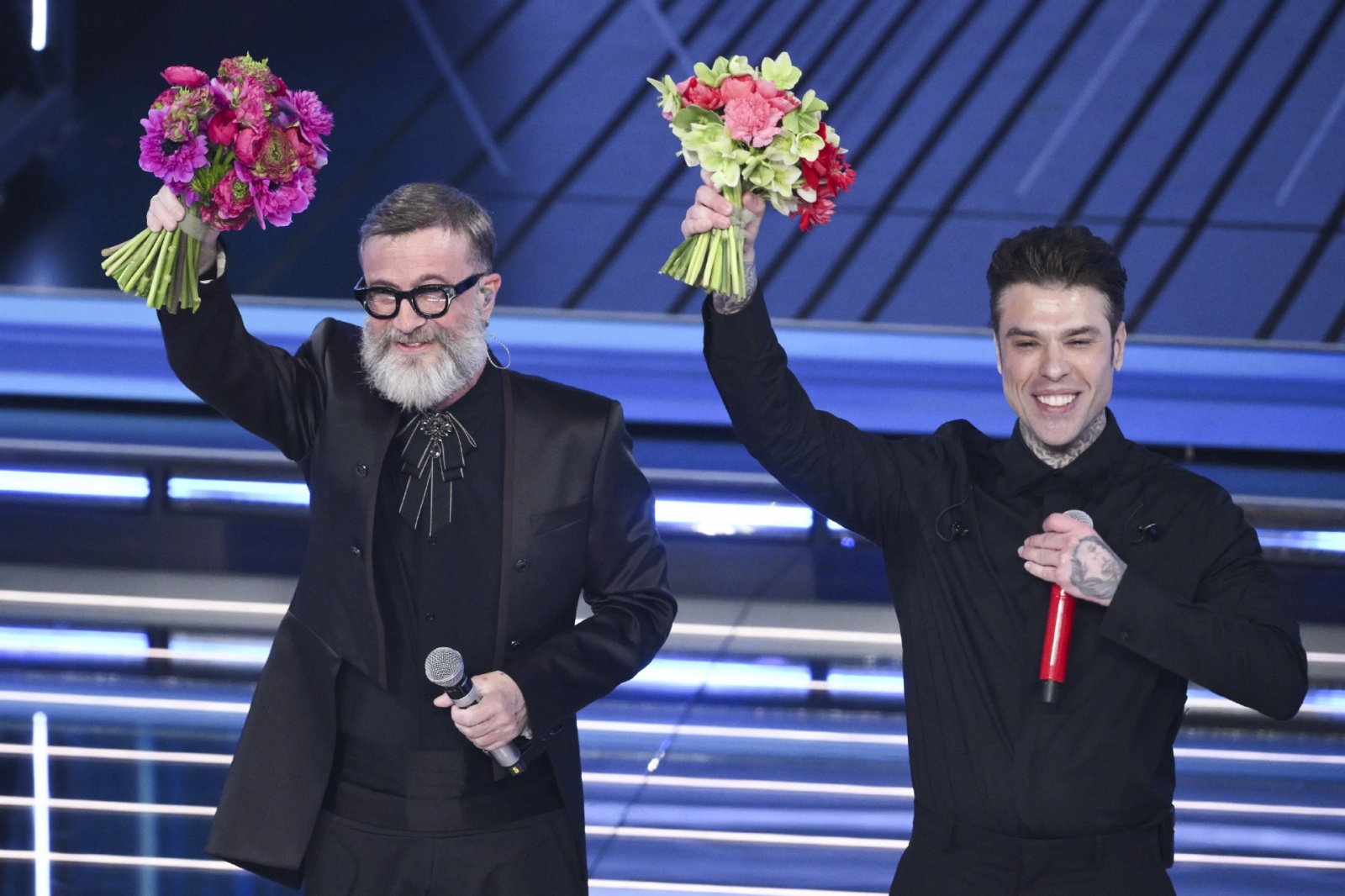 Italian singers Fedez (R) and Marco Masini (L) on stage at the Ariston theatre during the 76th edition of the Sanremo Italian Song Festival, in Sanremo, Italy, 24 February 2026. The music festival will run from 24 to 28 February 2026. ANSA/ETTORE FERRARI