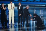 (L-R) Italian singers Laura Pausini, Achille Lauro, Sanremo Festival host and artistic director Carlo Conti, Italian singer Fausto Leali and Italian actor Lillo Petrolo on stage at the Ariston theatre during the 76th edition of the Sanremo Italian Song Fe