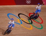 Italy's Simone Consonni (L) and Italy's Filippo Ganna celebrate after winning gold and setting a new World Record in the men's track cycling team pursuit finals during the Tokyo 2020 Olympic Games at Izu Velodrome in Izu, Japan, on August 4, 2021. (Photo 