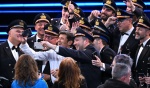 Italian singer and Sanremo Festival co-host Gianni Morandi with National Air Force band members on stage at the Ariston theatre during the 73rd Sanremo Italian Song Festival, in Sanremo, Italy, 11 February 2023. The music festival will run from 07 to 11 F