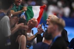 Gold medallist Italy's Nicolo Martinenghi celebrates after the men's 100m breaststroke swimming event during the Paris 2024 Olympic Games at the Paris La Defense Arena in Nanterre, west of Paris, on July 28, 2024. (Photo by SEBASTIEN BOZON / AFP)