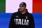 Italy's Nicolo Martinenghi prepares to compete in the final of the men's 100m breaststroke swimming event during the Paris 2024 Olympic Games at the Paris La Defense Arena in Nanterre, west of Paris, on July 28, 2024. (Photo by SEBASTIEN BOZON / AFP)