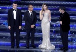 (L-R) Italian actor Giacomo Giorgio, Sanremo Festival host and artistic director Carlo Conti, Italian actors Vittoria Puccini and Carmine Recano on stage at the Ariston theatre during the 75th edition of the Sanremo Italian Song Festival, in Sanremo, Ital