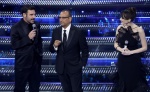 Sanremo Festival host and artistic director Carlo Conti (C) with Italian actors Edoardo Leo (L) and Pilar Fogliati on stage at the Ariston theatre during the 75th edition of the Sanremo Italian Song Festival, in Sanremo, Italy, 12 February 2025. The music