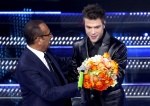 Sanremo Festival host and artistic director Carlo Conti (L) Italian singers Fedez (C) and Marco Masini (R) perform on stage at the Ariston theatre during the 75th edition of the Sanremo Italian Song Festival, in Sanremo, Italy, 14 February 2025. The music