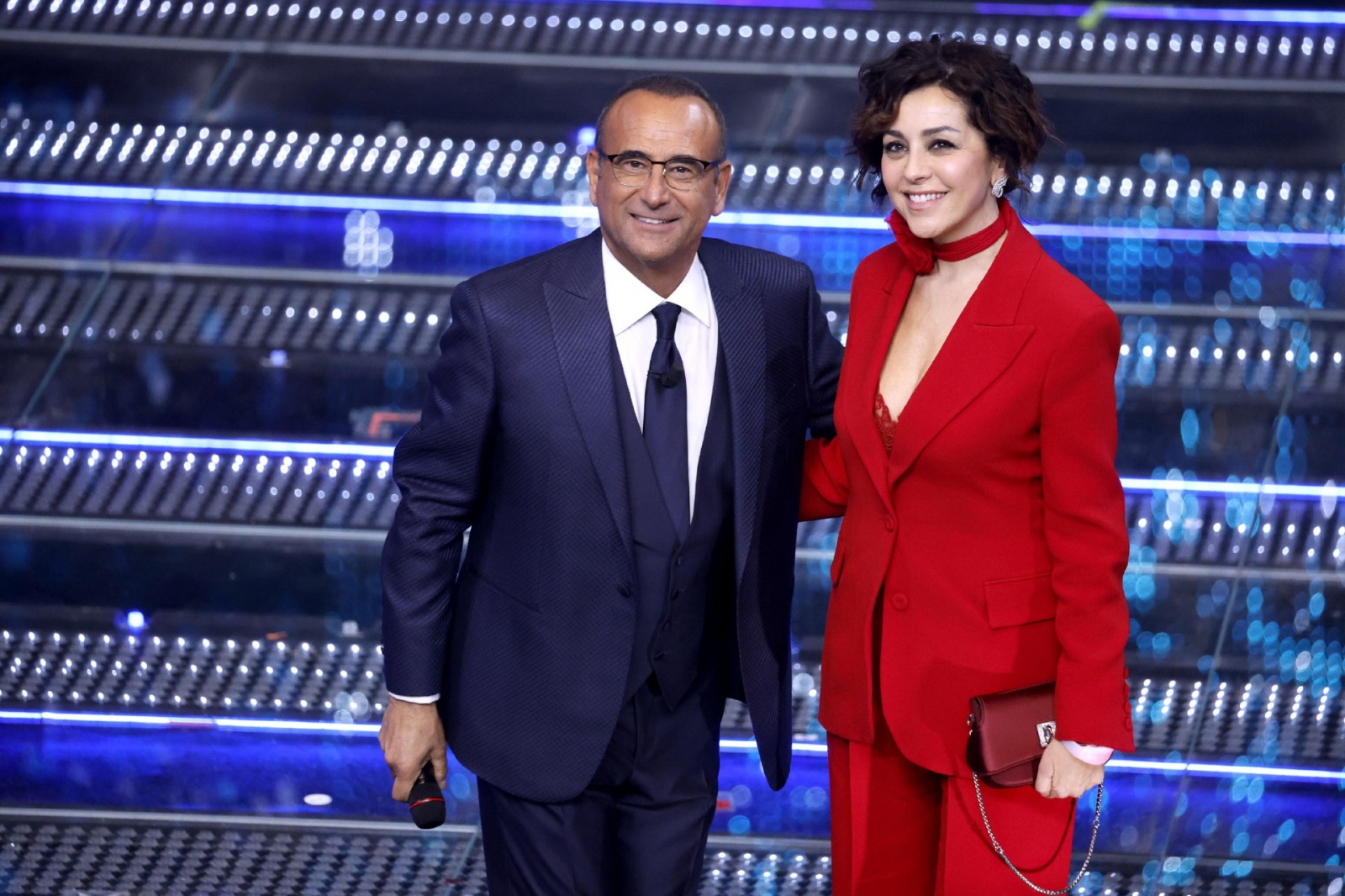 Sanremo Festival host and artistic director Carlo Conti with wife Francesca Vaccaroon stage at the Ariston theatre during the 75th edition of the Sanremo Italian Song Festival, in Sanremo, Italy, 14 February 2025. The music festival will run from 11 to 15