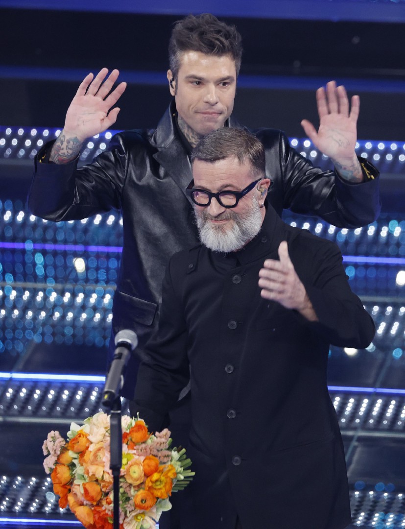 Italian singers Fedez (L) and Marco Masini perform on stage at the Ariston theatre during the 75th edition of the Sanremo Italian Song Festival, in Sanremo, Italy, 14 February 2025. The music festival will run from 11 to 15 February 2025. ANSA/FABIO FRUST