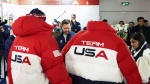 US Vice President JD Vance (V) and Second Lady Usha Vance (R) stand by Team USA jackets, as they attend the Team USA Welcome Experience ahead of the Milano Cortina 2026 Winter Olympic Games in Milan on February 5, 2026. (Photo by Kevin Lamarque / POOL / A